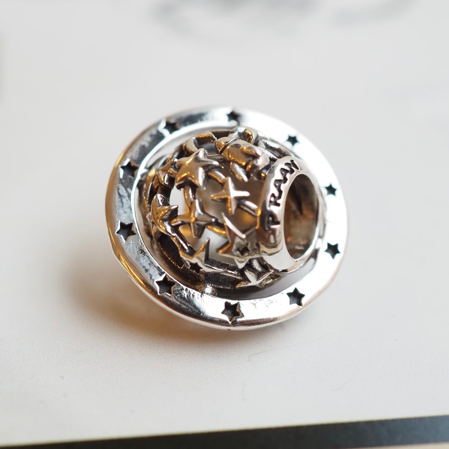 PRAAN Neon Saturn Charm